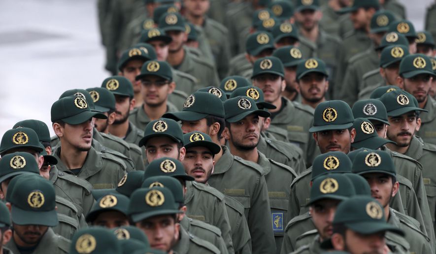Iranian Revolutionary Guard members arrive for a ceremony celebrating the 40th anniversary of the Islamic Revolution, at the Azadi, or Freedom, Square, in Tehran, Iran, Monday, Feb. 11, 2019. On Feb. 11, 1979. Iran&#39;s military stood down after days of street battles, allowing the revolutionaries to sweep across the country, and the government of Shah Mohammad Reza Pahlavi resigned. (AP Photo/Vahid Salemi)