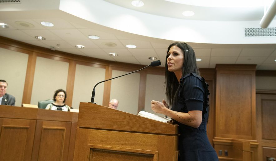 In this Wednesday, April 3, 2019 photo, Ashley Spence, of Austin testifies before the House Homeland Security and Public Safety Committee in Austin, Texas, in favor of HB 1399, a bill sponsored by state Rep. Reggie Smith, R-Van Alstyne, that would require DNA collection from most people accused in felony cases. Texas lawmakers are considering whether to expand DNA laws and allow samples to be taken from more defendants in criminal investigations. (Bob Daemmrich/Austin American-Statesman via AP)