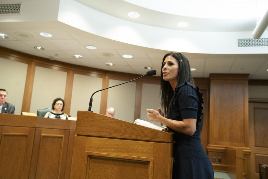 In this Wednesday, April 3, 2019 photo, Ashley Spence, of Austin testifies before the House Homeland Security and Public Safety Committee in Austin, Texas, in favor of HB 1399, a bill sponsored by state Rep. Reggie Smith, R-Van Alstyne, that would require DNA collection from most people accused in felony cases. Texas lawmakers are considering whether to expand DNA laws and allow samples to be taken from more defendants in criminal investigations. (Bob Daemmrich/Austin American-Statesman via AP)
