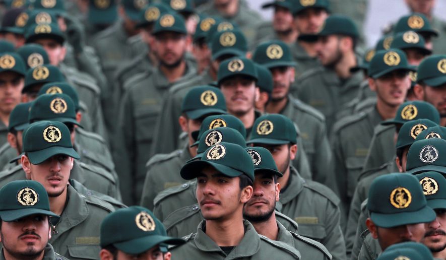 In this Feb. 11, 2019, file photo, Iranian Revolutionary Guard Corps members attend a ceremony celebrating the 40th anniversary of the Islamic Revolution, at the Azadi, or Freedom, Square in Tehran, Iran. (AP Photo/Vahid Salemi) ** FILE **