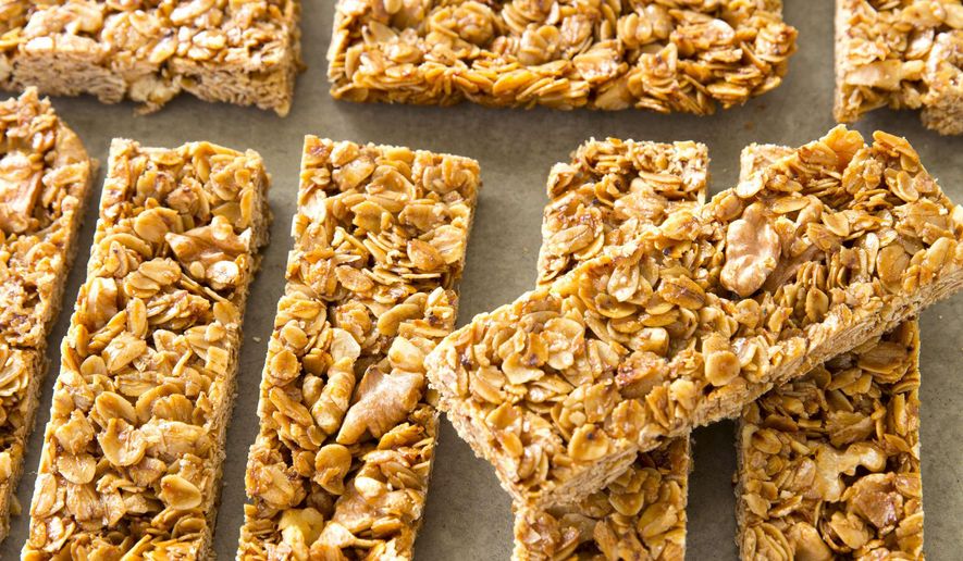 This undated photo provided by America's Test Kitchen in March 2019 shows Crunchy Granola Bars in Brookline, Mass. This recipe appears in the cookbook “The Perfect Cookie.” (Joe Keller/America's Test Kitchen via AP)