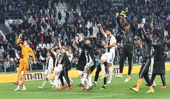 Juventus celebrate their victory at the end of the Italian Serie A soccer match between Juventus and AC Milan at the Allianz Stadium in Turin, Italy, Saturday, April 6, 2019.  (Andrea Di Marco/ANSA via AP)
