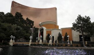 FILE - This Feb. 19, 2018, file photo, shows Wynn Las Vegas in Las Vegas. Las Vegas casino giant Wynn Resorts is in talks to buy Australia&#x27;s largest casino operator, Crown Resorts. Crown, which owns casinos in Melbourne, Perth and London and will soon open another in Sydney, confirmed in a statement on Tuesday, April 9, 2019 it was in confidential takeover discussions over a cash-and-scrip offer from Wynn. (AP Photo/Isaac Brekken, File)