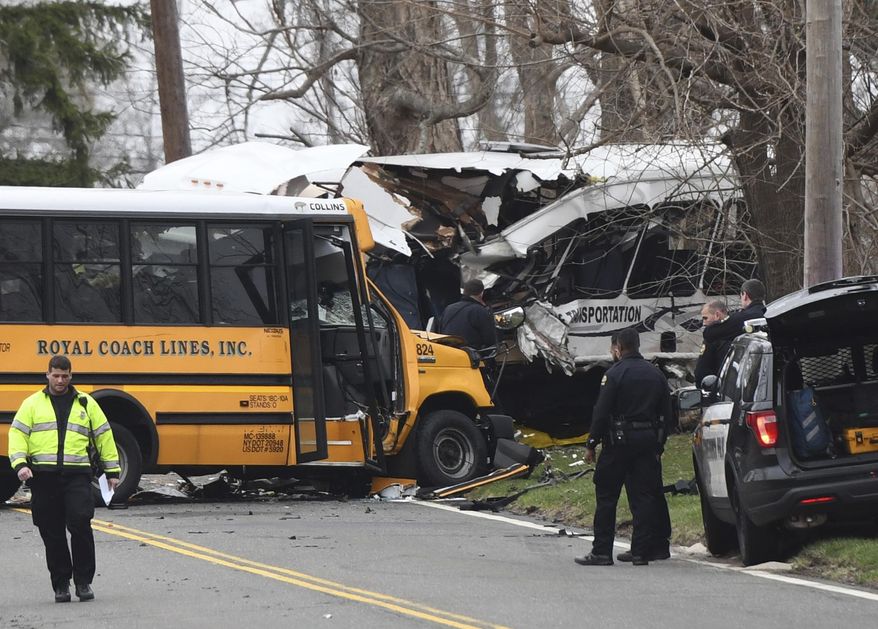 Police, EMS and firefighters respond to a school bus crash on King Street near Brunswick School in Greenwich, Conn. Tuesday, April 9, 2019. Police said multiple people were injured. (Tyler Sizemore/Hearst Connecticut Media via AP)