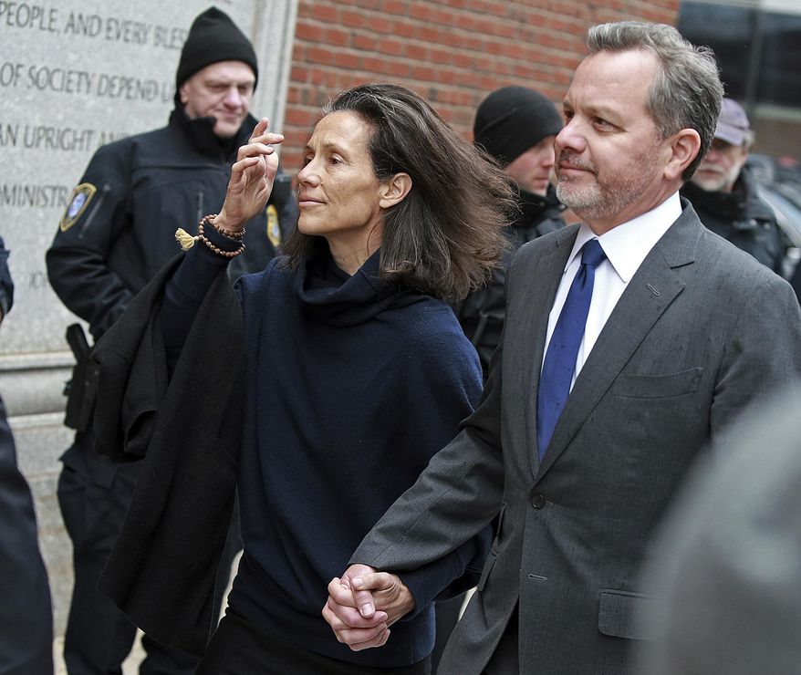 FILE - In this Friday, March 29, 2019 file photo, William McGlashan, 55, of Mill Valley, Calif., a senior executive at TPG private equity firm, arrives at the federal courthouse for a hearing associated with the college admissions bribery scandal in Boston. On Tuesday, April 9 McGlashan was among 16 prominent parents indicted on an additional charge of money laundering conspiracy in the case. (Matt Stone/The Boston Herald via AP, File)