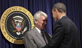 President Barack Obama, right, greets Greg Craig, left, his choice for White House counsel, as he meets with senior staff to assert expectations on ethics and conduct, at the Eisenhower Executive Office Building in the White House complex in Washington, Wednesday, Jan. 21, 2009. (AP Photo/J. Scott Applewhite) ** FILE **