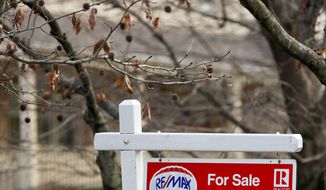 In this Jan. 3, 2019, file photo a Realtor sign marks a home for sale in Franklin Park, Pa. On Tuesday, Jan. 22, the National Association of Realtors reports on sales of existing homes in December. (AP Photo/Keith Srakocic, File)