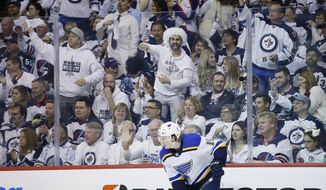 Winnipeg Jets&#x27; fans react towards St. Louis Blues center Robert Thomas (18) after the Jets were given a penalty during the second period of Game 1 of an NHL hockey first-round playoff series Wednesday, April 10, 2019, in Winnipeg, Manitoba. (John Woods/The Canadian Press via AP)