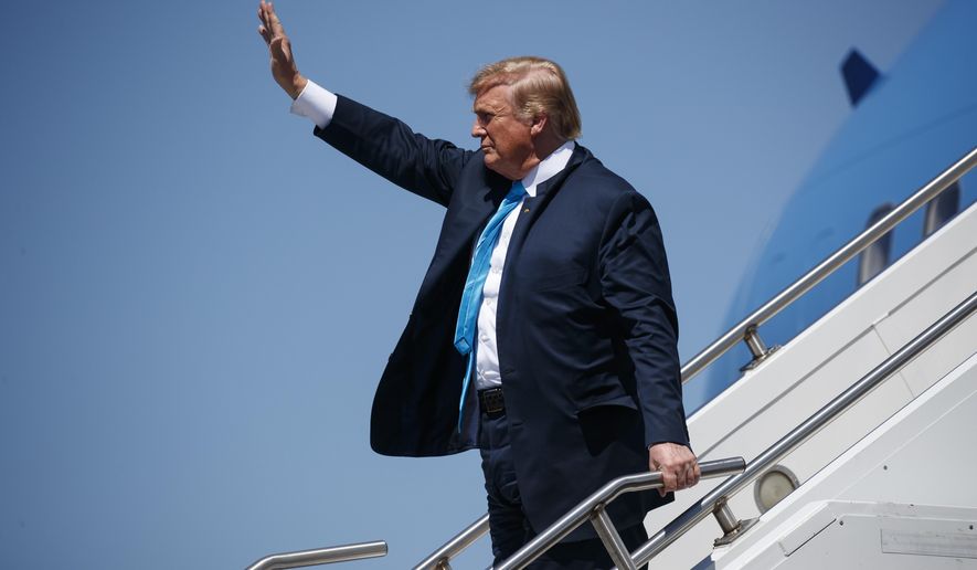President Donald Trump waves as he arrives at Ellington Joint Reserve Base, Wednesday, April 10, 2019, in Houston. (AP Photo/Evan Vucci)