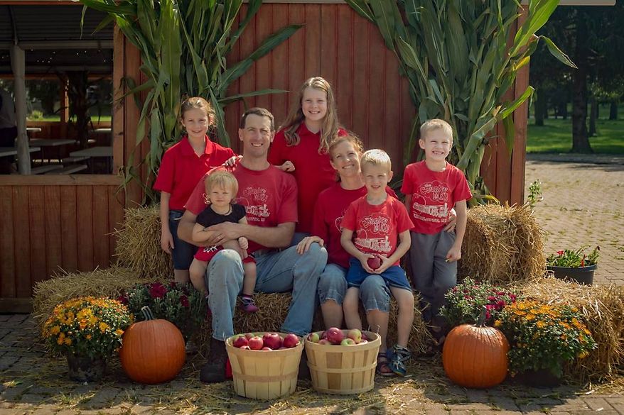 Steve and Bridget Tennes, shown with five of their six children, are fighting the East Lansing city council&#39;s effort to bar them from a farmers&#39; market based on their policy against hosting same-sex weddings on their farm in Charlotte, Michigan. (Provided courtesy of Alliance Defending Freedom)