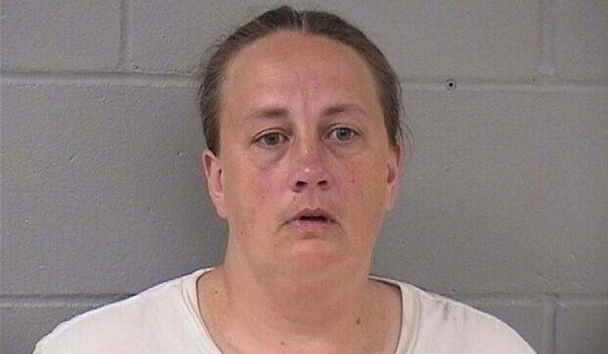 his booking photo taken Sept. 12, 2018 from the Hardin County Sheriff’s Office shows Traci Tyler. Tyler is charged with kidnapping for confining her boyfriend's 8-year-old son under basement stairs has been convicted of a lesser charge. A judge on Wednesday, April 10, 2019 found Tyler guilty of misdemeanor false imprisonment. Prosecutors say she and the boy's father, Alex Shadlow, locked the boy in the basement of their Ackley home for at least nine hours a day in summer 2017. (Hardin County Sheriff’s Office via AP)