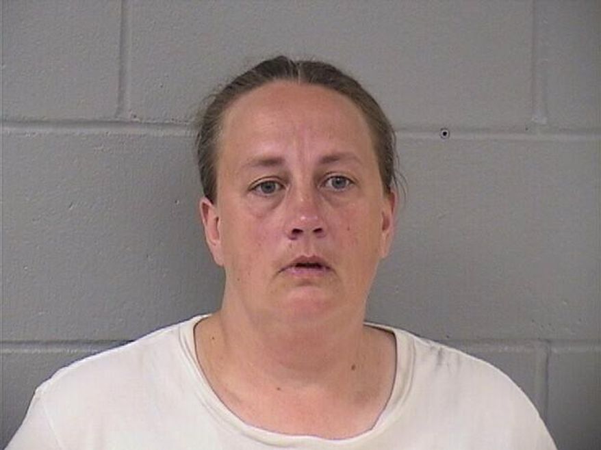 his booking photo taken Sept. 12, 2018 from the Hardin County Sheriff’s Office shows Traci Tyler. Tyler is charged with kidnapping for confining her boyfriend's 8-year-old son under basement stairs has been convicted of a lesser charge. A judge on Wednesday, April 10, 2019 found Tyler guilty of misdemeanor false imprisonment. Prosecutors say she and the boy's father, Alex Shadlow, locked the boy in the basement of their Ackley home for at least nine hours a day in summer 2017. (Hardin County Sheriff’s Office via AP)