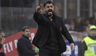 FILE - In this Sunday, March 17, 2019 file photo, AC Milan coach Gennaro Gattuso shouts out from the touchline during a Serie A soccer match between AC Milan and Inter Milan, at the San Siro stadium in Milan, Italy. Still smarting from controversial refereeing decisions and troubled by impending new financial fair play sanctions, AC Milan faces one of its most crucial matches of the season. Milan hosts Lazio on Saturday in a match that could prove fundamental to both teams&#39; Champions League hopes. Milan currently occupies fourth spot and the final Champions League berth but it is above Atalanta only on head-to-head record. Seventh-place Lazio is three points below Milan, but has played a match less. (AP Photo/Luca Bruno, File)