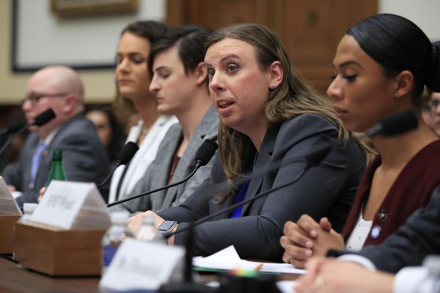 In this Feb. 27, 2019 file photo, Army Staff Sgt. Patricia King, second from right, together with other transgender military members, from left, Navy Lt. Cmdr. Blake Dremann, Army Capt. Alivia Stehlik, Army Capt. Jennifer Peace and Navy Petty Officer Third Class Akira Wyatt, testify about their military service before a House Armed Services Subcommittee on Military Personnel hearing on Capitol Hill in Washington. A new Trump administration regulation set to go into effect Friday, April 12, directs military secretaries to kick out transgender service members who refuse to serve in their birth sex and "given an opportunity to correct those deficiencies." (AP Photo/Manuel Balce Ceneta, File) **FILE**