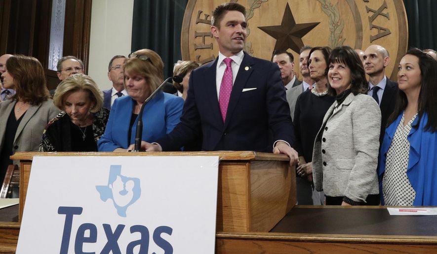 FILE - In this March 7, 2019 file photo, State Rep. Jeff Leach, at podium, stands with fellow lawmakers and guests to talk about the Texas Born-Alive bill, in Austin, Texas. Leach, a Republican lawmaker is blocking a bill that would allow the death penalty for women seeking abortions says local authorities are monitoring his home near Dallas. A Texas sheriff's department said Thursday, April 11, 2019 it had "security concerns" over social media posts targeting Leach, who has come under fire by some conservative activists after blocking a bill that could lead to a woman being charged with homicide if she has an abortion. (AP Photo/Eric Gay, File)