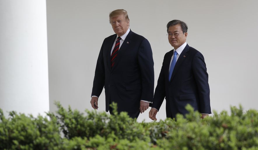 President Donald Trump walks with South Korean President Moon Jae-In to the Oval Office of the White House, Thursday, April 11, 2019, in Washington. (AP Photo/Evan Vucci)