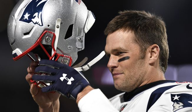 FILE - In this Oct. 29, 2018, file photo, New England Patriots quarterback Tom Brady puts on his helmet for warmups prior to an NFL football game against the Buffalo Bills, in Orchard Park, N.Y. Improvements that an NFL and NFLPA study found in helmets didn&#x27;t help Tom Brady. The six-time Super Bowl champion quarterback will have to discard his longtime brand as one of 11 helmets banned by the league and players&#x27; union for 2019. Brady was one of 32 players wearing helmets last season under a grace period that is now eliminated.(AP Photo/Adrian Kraus, File)