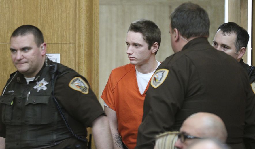 Colten Treu is led into Chippewa County Court for a preliminary hearing, Friday, April 12, 2019, in Chippewa Falls, Wis. The 22-year-old is accused in a hit-and-run crash that killed three Girl Scouts and a mother last November as they collected trash along a highway in Wisconsin. (Dan Reiland/The Eau Claire Leader-Telegram via AP)