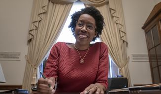 Rep. Lauren Underwood, D-Ill., works in her office on Capitol Hill in Washington, Wednesday, April 3, 2019. House Democrats are rounding the first 100 days of their new majority taking stock of their accomplishments, noting the stumbles and marking their place as a frontline of resistance to President Donald Trump. (AP Photo/J. Scott Applewhite)