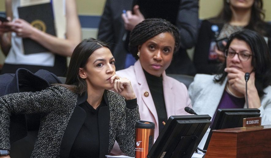 Rep. Alexandria Ocasio-Cortez, D-N.Y., left, joined by Rep. Ayanna Pressley, D-Mass., and Rep. Rashida Tlaib, D-Mich., listens during a House Oversight and Reform Committee meeting, on Capitol Hill in Washington, Tuesday, Feb. 26, 2019. (AP Photo/J. Scott Applewhite) ** FILE **