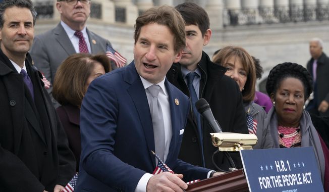 Rep. Dean Phillips, D-Minn., speaks as Democrats rally outside the Capitol ahead of passage of H.R. 1, &amp;quot;The For the People Act,&amp;quot; a bill which aims to expand voting rights and strengthen ethics rules, in Washington, Friday, March 8, 2019.  House Democrats are rounding the first 100 days of their new majority taking stock of their accomplishments, noting the stumbles and marking their place as a frontline of resistance to President Donald Trump.(AP Photo/J. Scott Applewhite)