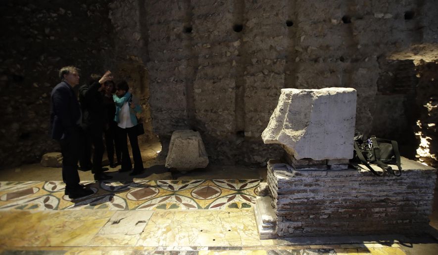 People walk in the Domus Transitoria, the first imperial palace of Roman Emperor Nero on the Palatine Hill in Rome, during its opening for the press, Thursday, April 11, 2019. Following the great fire of 64 AD, the palace was replaced by the Domus Aurea, Nero's Golden Palace. (AP Photo/Alessandra Tarantino)