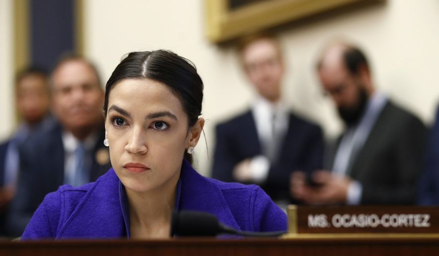 In this Wednesday, April 10, 2019, file photo, Rep. Alexandria Ocasio-Cortez, D-N.Y., listens during a House Financial Services Committee hearing with leaders of major banks on Capitol Hill in Washington. (AP Photo/Patrick Semansky, File)