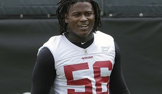 FILE - In this May 30, 2018, file photo, then-San Francisco 49ers linebacker Reuben Foster walks on the field during a practice at the team&#39;s NFL football training facility in Santa Clara, Calif. Foster has been fined two game checks and reinstated to the Washington Redskins’ active roster after an NFL investigation found he did not violate the league’s personal conduct policy. The league announced Foster’s punishment and new status Friday, April 12, 2019. (AP Photo/Jeff Chiu, File)