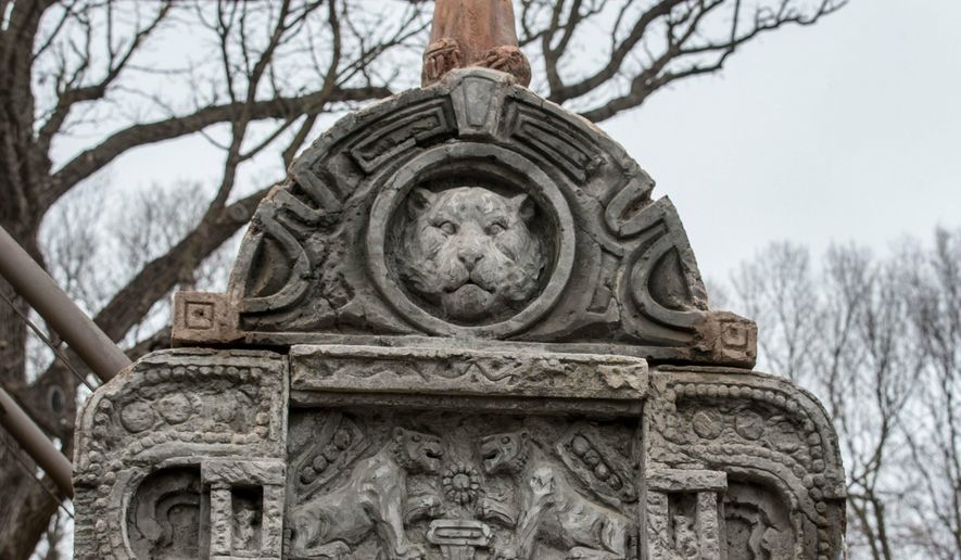 In a Friday, April 5, 2019 photo, some of the finishing touches on buildings are made to look similar to what you would find in the Himalayan Foothills, in the Omaha's Henry Doorly Zoo and Aquarium's Asian Highlands exhibit.The Henry Doorly Zoo & Aquarium is putting the finishing touches on its 8-acre, $22 million Asian Highlands exhibit, set to open May 17. (Chris Machian/Omaha World-Herald via AP)