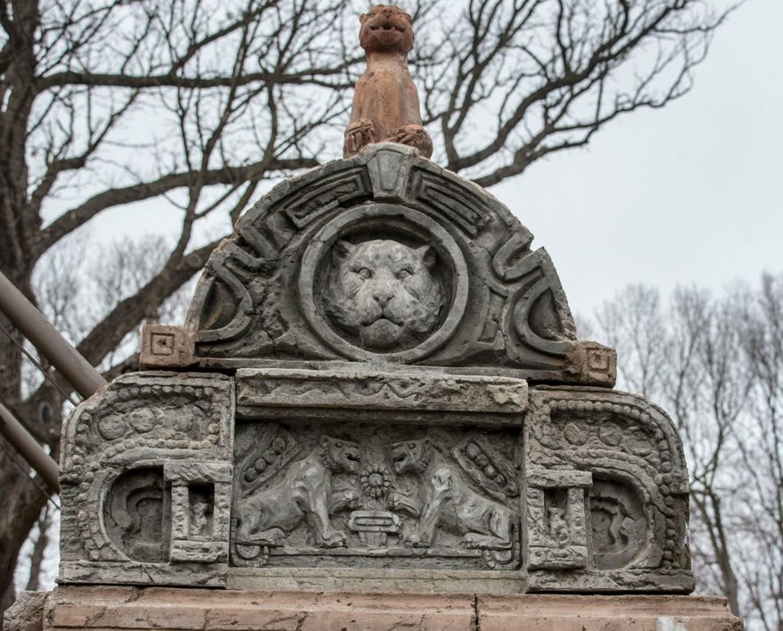 In a Friday, April 5, 2019 photo, some of the finishing touches on buildings are made to look similar to what you would find in the Himalayan Foothills, in the Omaha's Henry Doorly Zoo and Aquarium's Asian Highlands exhibit.The Henry Doorly Zoo & Aquarium is putting the finishing touches on its 8-acre, $22 million Asian Highlands exhibit, set to open May 17. (Chris Machian/Omaha World-Herald via AP)
