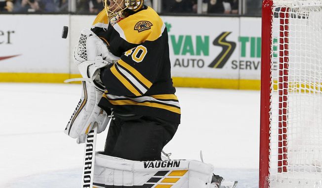 Boston Bruins goaltender Tuukka Rask (40) makes a save off his chest during the first period of Game 2 of an NHL hockey first-round playoff series against the Toronto Maple Leafs, Saturday, April 13, 2019, in Boston. (AP Photo/Mary Schwalm)