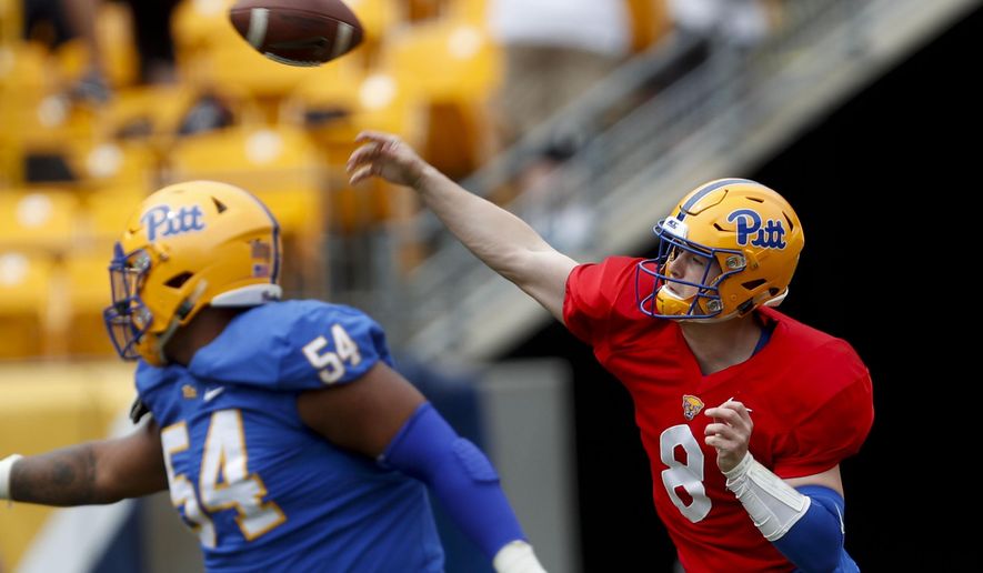 Pittsburgh quarterback Kenny Pickett (8) gets off a pass as offensive guard Rashad Wheelers looks to block during their annual intrasquad Blue-Gold spring NCAA college football game, Saturday, April 13, 2019, in Pittsburgh. (AP Photo/Keith Srakocic)
