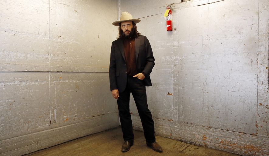 Los Angeles artist Erik Brunetti, the founder of the streetwear clothing company "FUCT," poses for a photo in Los Angeles Thursday, April, 11, 2019. “We wanted the viewer to question it: Like, is that pronounced the way I think it’s pronounced?” he said of his streetwear brand “FUCT,” which began selling clothing in 1991. On April 15, the Supreme Court will hear Brunetti’s challenge to a part of federal law that says officials should refuse to register trademarks that are “scandalous” or “immoral.” (AP Photo/Damian Dovarganes)