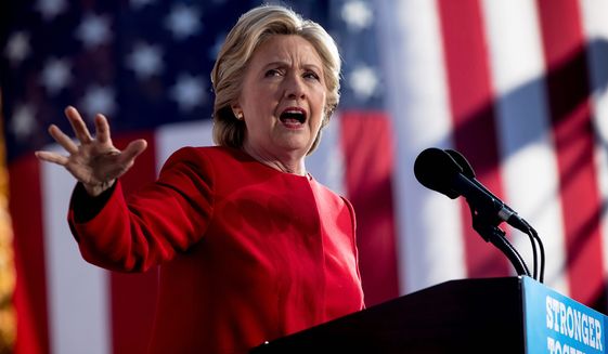 Democratic presidential candidate Hillary Clinton speaks at a rally at the Cathedral of Learning at the University of Pittsburgh in Pittsburgh, Pa., Monday, Nov. 7, 2016. (AP Photo/Andrew Harnik) ** FILE **