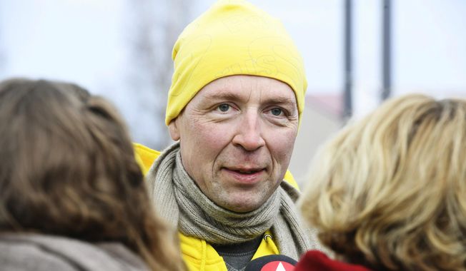 Chairman of the Finns Party Jussi Halla-aho campaigns for the Finnish parliamentary elections in Tuusula, Finland, Saturday, April 13, 2019, a day ahead of the elections. (Heikki Saukkomaa/Lehtikuva via AP)