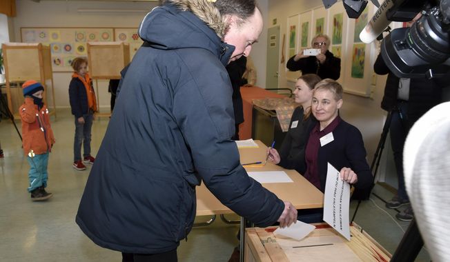 The chairman of the Finns Party and parliamentary candidate Jussi Halla-aho votes in the parliamentary elections, in Helsinki, Finland Sunday, April 14, 2019. Finns are voting in a parliamentary election in which reforming the nation’s generous welfare model and tackling climate change have emerged as key issues.(Emmi Korhonen/Lehtikuva via AP)