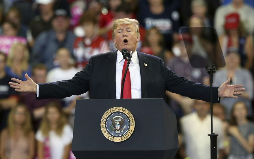 FILE - In this June 20, 2018 file photo, U.S. President Donald Trump speaks at a campaign rally in Duluth, Minn. Trump heads back to Minnesota on the nation&#39;s tax filing deadline, Monday, April 15, 2019, eager to remind voters in a state he nearly carried in 2016 about the $1.5 trillion Republican tax cut. It&#39;s a policy achievement that won&#39;t resonate with everyone in Minnesota, where the loss of the state tax deduction hurt some taxpayers. And national polls show most Americans don&#39;t have a clear idea what the tax cuts did for them. (AP Photo/Jim Mone File)