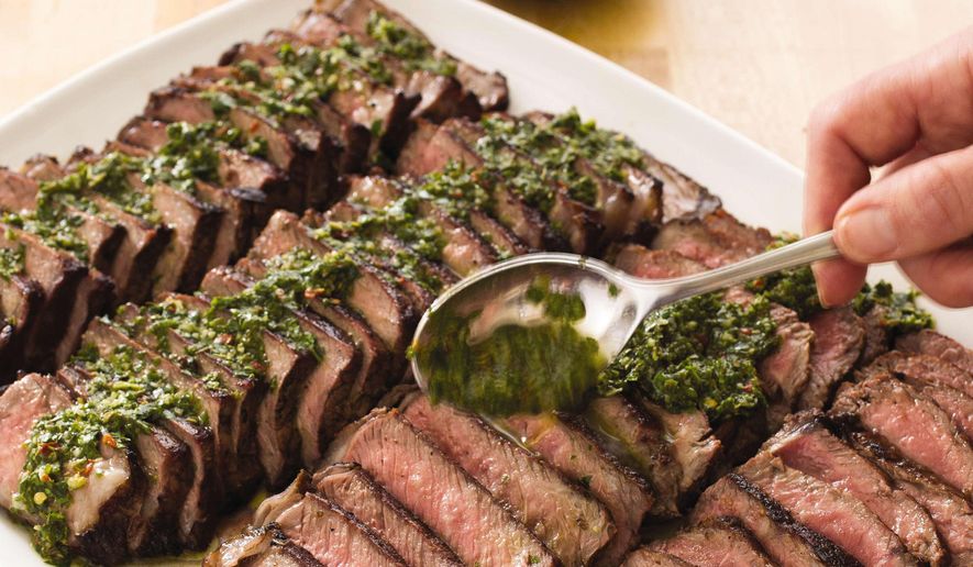 This undated photo provided by America's Test Kitchen in April 2019 shows Argentine Steaks with Chimichurri Sauce in Brookline, Mass. This recipe appears in the cookbook "Vegetables Illustrated." (Carl Tremblay/America's Test Kitchen via AP)