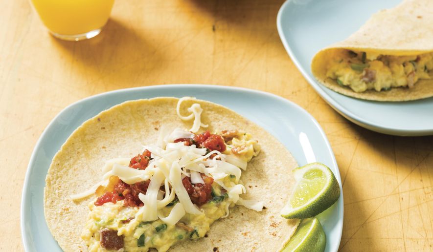 This undated photo provided by America's Test Kitchen in April 2019 shows Breakfast Tacos in Brookline, Mass. This recipe appears in “The Complete Cookbook for Young Chefs.” (Daniel J. van Ackere/America's Test Kitchen via AP)