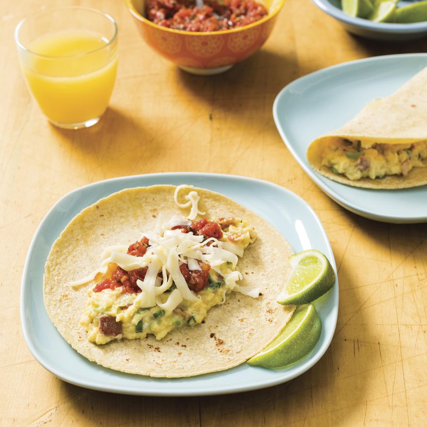 This undated photo provided by America's Test Kitchen in April 2019 shows Breakfast Tacos in Brookline, Mass. This recipe appears in “The Complete Cookbook for Young Chefs.” (Daniel J. van Ackere/America's Test Kitchen via AP)