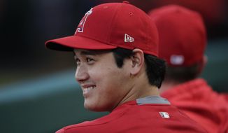 Los Angeles Angels&#39; Shohei Ohtani, of Japan, smiles in the dugout before the team&#39;s baseball game against the Milwaukee Brewers, Wednesday, April 10, 2019, in Anaheim, Calif. (AP Photo/Jae C. Hong)
