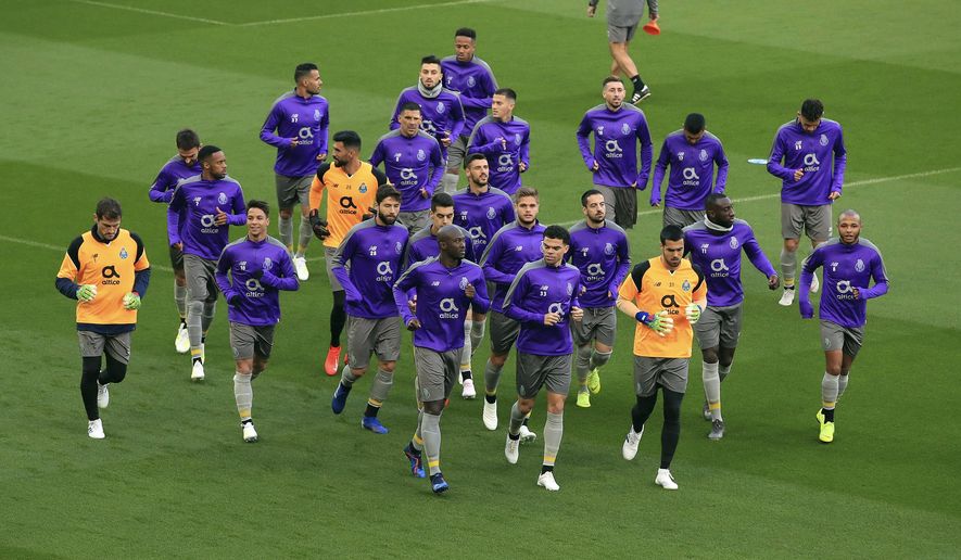 Porto&#39;s Danilo Pereira, front left, Pepe, front right, and Iker Casillas, far left, attend a training session at Anfield, Liverpool, England, Monday, April 8, 2019. Porto will play Liverpool in a Champions League quarter final soccer match on Tuesday. (Peter Byrne/PA via AP)