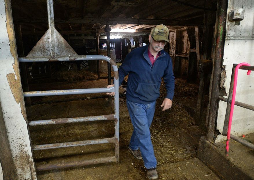 Dean Curtis is shown April 11, 2019 in the empty milking parlor of his farm in Venango Township, Erie County, Pa. Curtis sold his 150 dairy cows in June 2018, shutting down a family dairy farm that had been in operation since 1931. (Jack Hanrahan/Erie Times-News via AP)