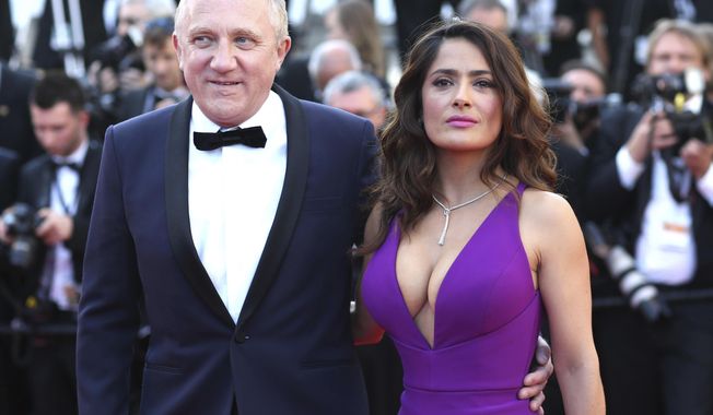 FILE - In this Sunday, May 17, 2015 file photo Francois-Henri Pinault and Salma Hayek pose for photographers upon arrival for the screening of the film Carol at the 68th international film festival, Cannes, southern France. Businessman Francois-Henri Pinault and his billionaire father Francois Pinault said they were immediately giving 100 million euros from their company, Artemis, to help finance repairs to fire damaged Notre Dame cathedral. A statement from Francois-Henri Pinault said &amp;quot;this tragedy impacts all French people&amp;quot; and &amp;quot;everyone wants to restore life as quickly as possible to this jewel of our heritage.&amp;quot; (AP Photo/Thibault Camus, File)