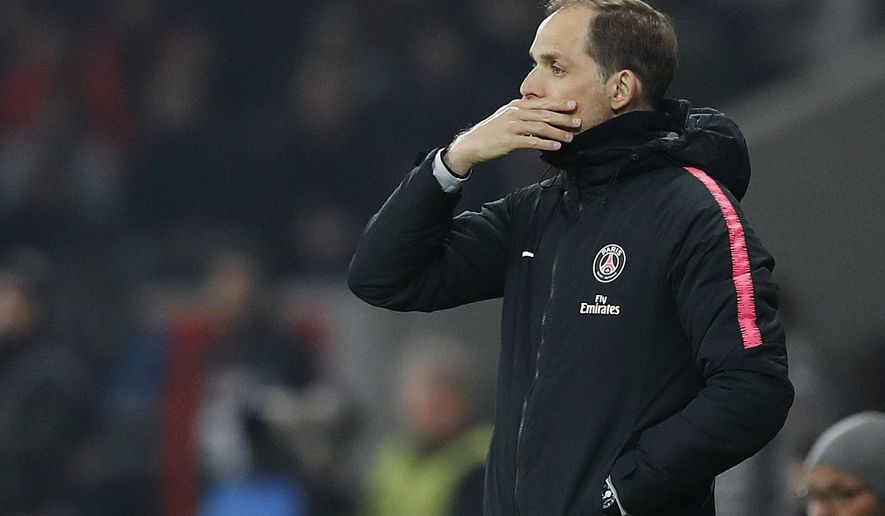 PSG&#39;s coach Thomas Tuchel watches his team during the French League One soccer match between OSC Lille and Paris Saint-Germain at Stade Pierre Mauroy in Lille, France, Sunday, April 14, 2019.(AP Photo/Christophe Ena)