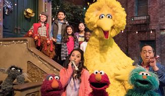 This image released by HBO shows the cast of the popular children&#x27;s show &amp;quot;Sesame Street.&amp;quot; Big Bird, Elmo and stars of “Sesame Street” are leaving their quiet neighborhood and hitting the road. The non-profit Sesame Workshop said Tuesday a selection of Muppets will embark on a 10-city trip to celebrate the show’s 50th anniversary campaign with free park festivals, live performances and kid-friendly activities. (HBO via AP)