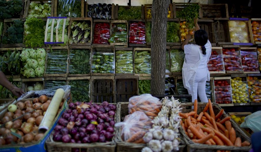 A array of fruits and vegetables are displayed for sale at a street market in Buenos Aires, Argentina, Tuesday, April 16, 2019. Argentina&#39;s national statistics official agency announced the inflation figures for March. Despite efforts by President Mauricio Macri&#39;s government to tame runaway inflation the monthly metric continues to present troubling results. (AP Photo/Natacha Pisarenko)