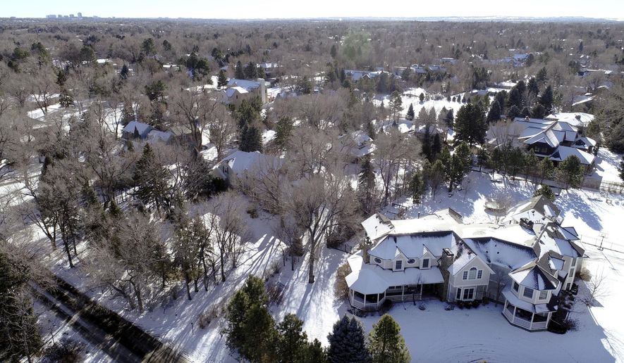 This Jan. 3, 2019 photo shows snow covered Swastika Acres in Englewood, Colo. The neighborhood in the Denver suburb was named Swastika Acres decades before the symbol was adopted by the Nazis. KDVR-TV reports the Cherry Hills Village City Council voted unanimously Tuesday, April 16, 2019, to approve a name change to "Old Cherry Hills" to prevent future controversy. (Hyoung Chang/The Denver Post via AP)