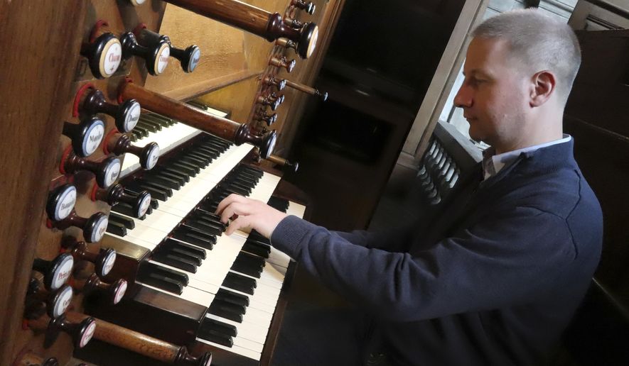 Johann Vexo, the organist who was playing at evening mass inside Notre Dame when flames began licking at the iconic cathedral&#39;s roof, pllays the pipe organ at Notre Dame de Nancy cathedral, eastern France, Wednesday, April 17, 2019. Vexo , who was playing at evening mass inside Notre Dame when flames began licking at the iconic cathedral&#39;s roof says people didn&#39;t immediately react when the fire alarm rang as a priest was reading from the Bible. (AP Photo/Oleg Cetinic)