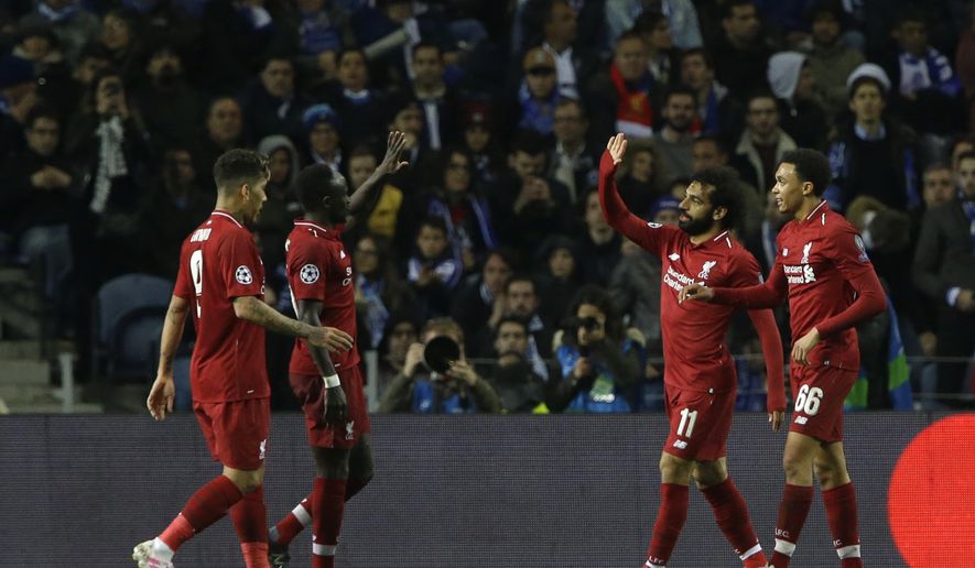 Liverpool&#39;s Mohamed Salah, second right, celebrates after scoring his side&#39;s second goal during the Champions League quarterfinal, 2nd leg, soccer match between FC Porto and Liverpool at the Dragao stadium in Porto, Portugal, Wednesday, April 17, 2019. (AP Photo/Armando Franca)